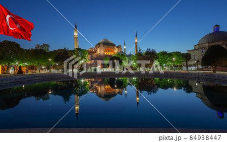 Hagia Sophia Mosque in morning with Turkish flag in Istanbul 84938447