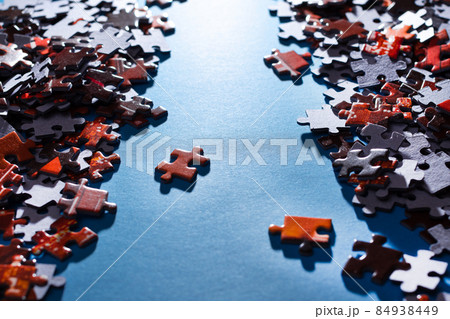 Colorful Jigsaw Puzzle on Blue Background Colorful Jigsaw Puzzle on Blue Background 84938449
