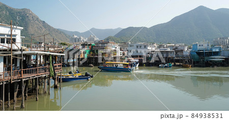 wide photography traditional Hong Kong old wooden house, boat and river in countryside wide photography traditional Hong Kong old wooden house, boat and river in countryside 84938531