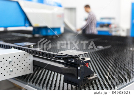 Man working at programmable machine 84938623