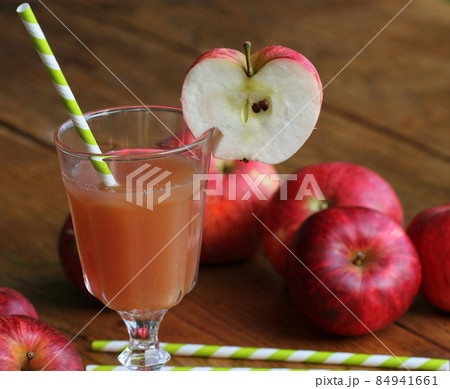 Fresh apple juice in glass with red apple on rustic wooden table .Selective Focus, Fresh apple juice in glass with red apple on rustic wooden table .Selective Focus, 84941661