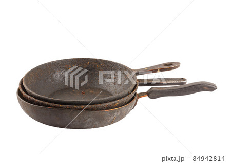 old disgusting stained rusty cast iron pan stack with burnt fat and food leftovers isolated 84942814