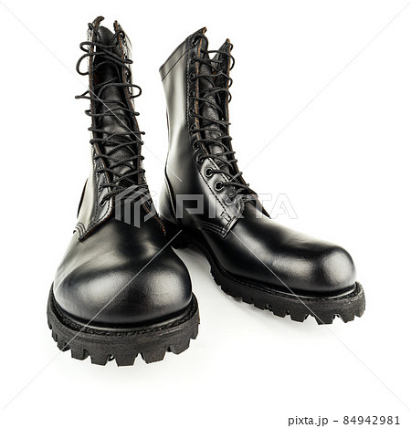 three quarter front view on pair of black leather 10-inch new black military combat boots, isolated on white background 84942981