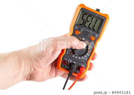 the word sell on screen of digital electrical multimeter in left hand, isolated on white the word sell on screen of digital electrical multimeter in left hand, isolated on white 84943181