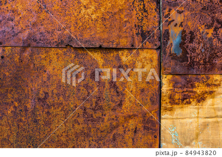 Rusted flat composite nailed metal sheets surface background and texture. Rusted flat composite nailed metal sheets surface background and texture. 84943820