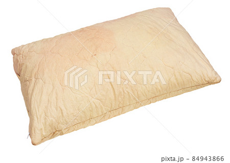 dirty used spotted pillow isolated on white background in diagonal composition dirty used spotted pillow isolated on white background in diagonal composition 84943866