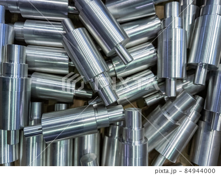 shiny cylindrical aluminium parts close-up full frame industrial background 84944000