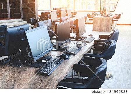 Group of computer with monitor neatly placed in a computer lab, computer room in the office modern with windows 84946383