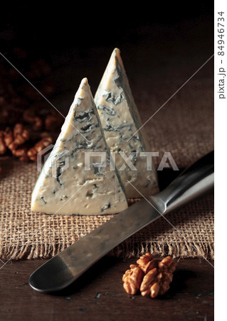 Blue cheese, walnuts, and cheese knife. Blue cheese, walnuts, and cheese knife. 84946734