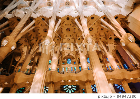 Gaudi's Masterpiece Sagrada Familia Basilica. Light through stained glass windows. Mosaic. UNESCO 84947280
