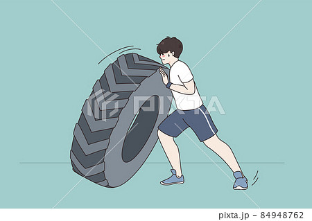 Sportsman push tire training in gym 84948762