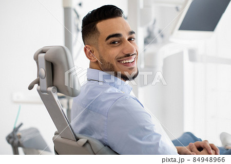Dental Clinic Patient. Portrait Of Smiling Arab Male Posing In Dentist Chair 84948966