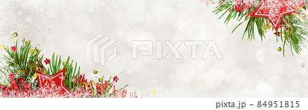 Christmas header with pine tree, decorative clock and red wooden stars on white bokeh background with snowflakes 84951815