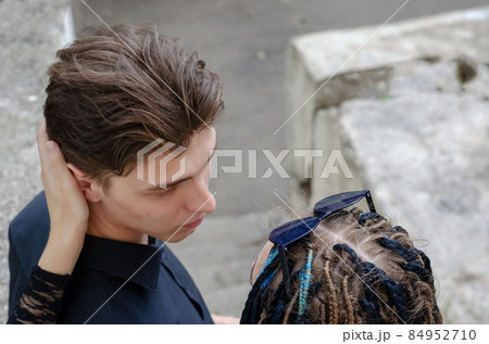 A young man and a woman embracing. A young man and a woman embracing. 84952710