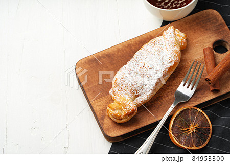 Traditional apple strudel on wooden board, close up 84953300