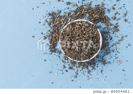 Dried sage leaves on blue background. Top view Dried sage leaves on blue background. Top view 84954461