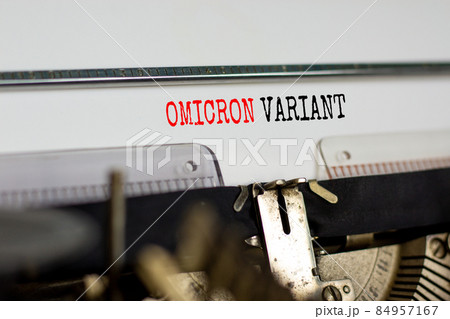 Covid-19 new omicron virus variant symbol. Concept words Omicron variant typed on retro typewriter. Medical and COVID-19 pandemic new omicron variant strain mutation concept. 84957167