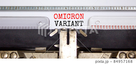 Covid-19 new omicron virus variant symbol. Concept words Omicron variant typed on retro typewriter. Medical and COVID-19 pandemic new omicron variant strain mutation concept. 84957168