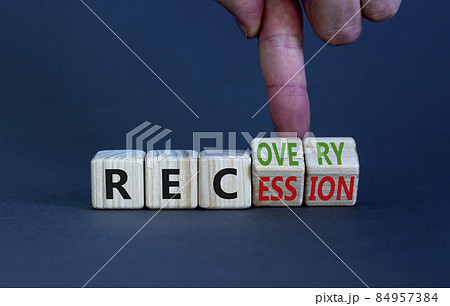 Recovery and recession symbol. Businessman turns cubes and changes the word 'recession' to 'recovery'. Beautiful grey table, grey background. Business and recovery - recession concept. Copy space. Recovery and recession symbol. Businessman turns cubes and changes the word 'recession' to 'recovery'. Beautiful grey table, grey background. Business and recovery - recession concept. Copy space. 84957384