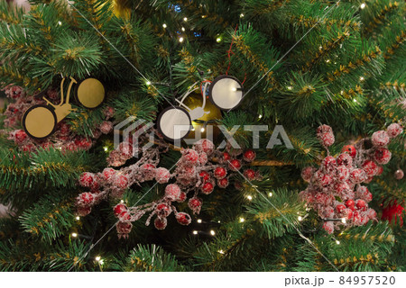 The Christmas tree is decorated with toy bicycles. Dream concept, bike as a gift. Extraordinary design. Style. The Christmas tree is decorated with toy bicycles. Dream concept, bike as a gift. Extraordinary design. Style. 84957520