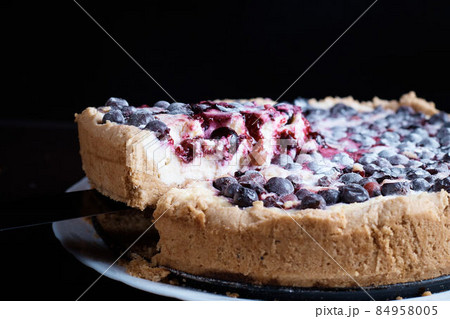 Berry pie cake from the cherries currants in a bowl of fresh steam a whole and slices of hot background blurred Berry pie cake from the cherries currants in a bowl of fresh steam a whole and slices of hot background blurred 84958005