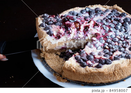 Berry pie cake from the cherries currants in a bowl of fresh steam a whole and slices of hot background blurred Berry pie cake from the cherries currants in a bowl of fresh steam a whole and slices of hot background blurred 84958007