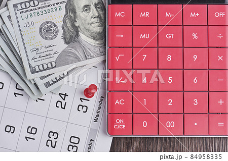 Calculator, us dollars and monthly calendar. Pay day, last day concepts. Concept of pay day, pay for utility bills, pay debts. Last day for paying loans, paying credits and bills Calculator, us dollars and monthly calendar. Pay day, last day concepts. Concept of pay day, pay for utility bills, pay debts. Last day for paying loans, paying credits and bills 84958335