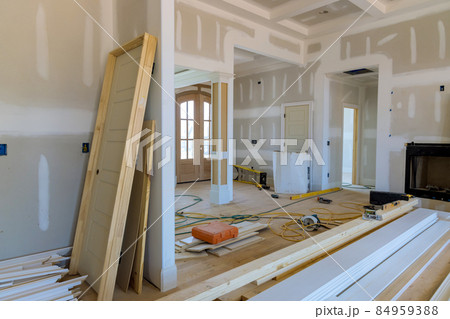 View of on stacker wooden material door molding trim with new house of under construction 84959388
