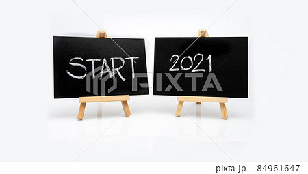 The message "START 2021" is written in white chalk on a black chalk board. The message "START 2021" is written in white chalk on a black chalk board. 84961647
