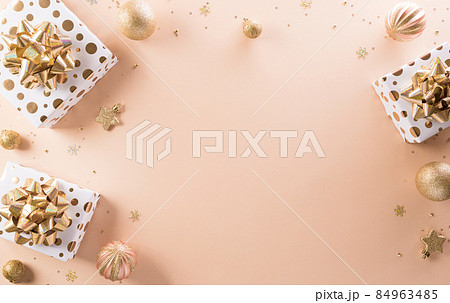 Happy new year celebration background concept made from champagne and glasses, gift box and christmas ball on pastel background. 84963485