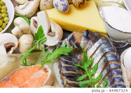 Healthy food, foods rich in vitamin D and protein, chicken quail eggs, butter, sea fish salmon mackerel, dairy products cream milk cheese, mushrooms, champignons, canned green peas Healthy food, foods rich in vitamin D and protein, chicken quail eggs, butter, sea fish salmon mackerel, dairy products cream milk cheese, mushrooms, champignons, canned green peas 84967324