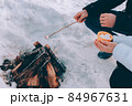 couple roast marshmallow over campfire. winter theme 84967631