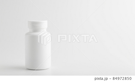 Jar of pills isolate. White plastic jar for medical pills, drugs and vitamins on a blank white background. Jar of pills isolate. White plastic jar for medical pills, drugs and vitamins on a blank white background. 84972850