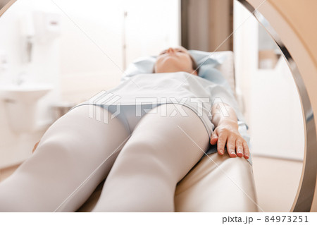 Medical CT or MRI Scan with a patient in the modern hospital laboratory. Interior of radiography department. Technologically advanced equipment in white room. Magnetic resonance diagnostics machine. 84973251
