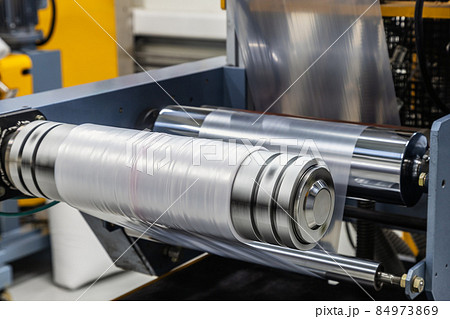 machine with roll of newly produced transparent plastic film 84973869