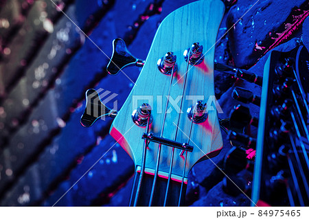Guitar headstock with tuners on dark background Guitar headstock with tuners on dark background 84975465