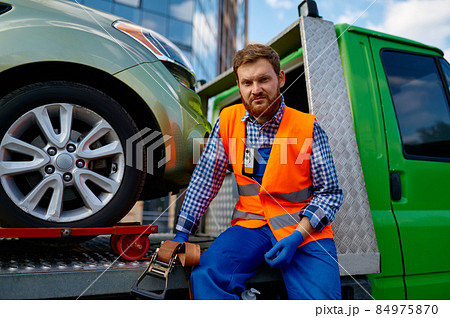 Portrait of serious male tow truck operator Portrait of serious male tow truck operator 84975870