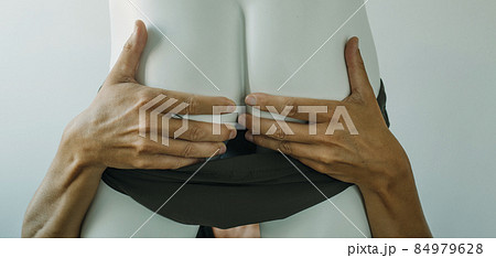 grabbing the buttocks of a mannequin, web banner 84979628