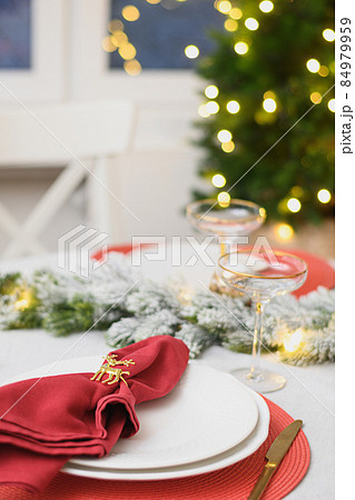 Christmas table setting, red towel with gold ring. Family holiday dinner or New Year party. Christmas table setting, red towel with gold ring. Family holiday dinner or New Year party. 84979959
