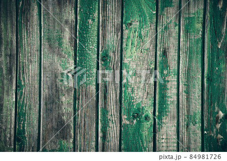 Old wooden grunge board painted in different shades of green color Old wooden grunge board painted in different shades of green color 84981726