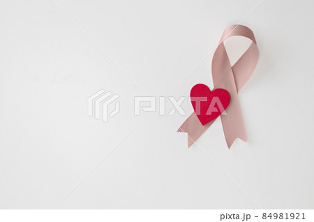 Breast Cancer Awareness Pink Ribbon en red heart . World Breast Cancer Day concept . Women healthcare concept isolated on white background 84981921