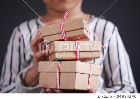 child hand hold homemade gift box 84984240