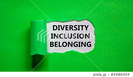 Inclusion and belonging symbol. Words 'diversity, inclusion, belonging' appearing behind torn green paper. Beautiful green background. Business, better inclusion and belonging concept. Copy space. Inclusion and belonging symbol. Words 'diversity, inclusion, belonging' appearing behind torn green paper. Beautiful green background. Business, better inclusion and belonging concept. Copy space. 84986404