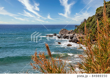 Sea waves crashing onto rocks with water splashes. Corfu island, Greece. 84989350