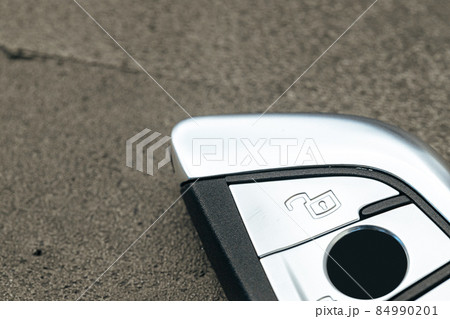 Modern automobile car key on black concrete background Modern automobile car key on black concrete background 84990201