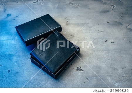 Black leather wallet on grey concrete background 84990386