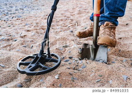 Metal detector coil in action above the ground 84991035