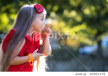 Portrait of happy pretty child girl smiling outdoors enjoying warm sunny summer day. Portrait of happy pretty child girl smiling outdoors enjoying warm sunny summer day. 84991476