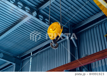 Industrial crane hook in a modern factory building 84991923