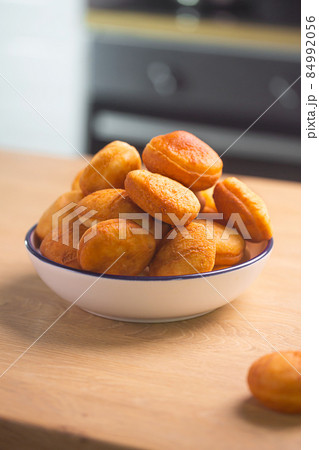 Traditional Kazakh baursak dish prepared with dough Traditional Kazakh baursak dish prepared with dough 84992056